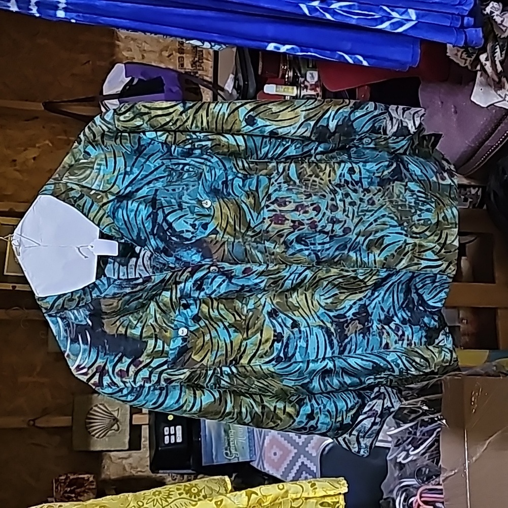 Ladies Jacket, sorry about the sun ray across it. Sun was shining thru window.